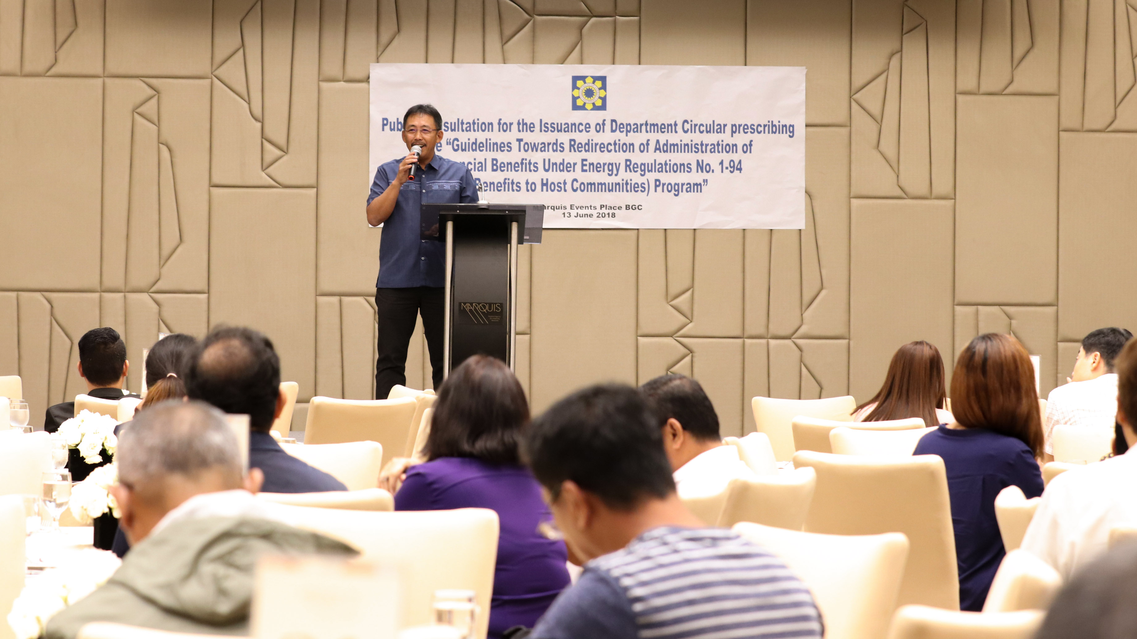 BENEFITS OF POWER: Department of Energy-Electric Power Industry Management Bureau (DOE-EPIMB) Director Mario Marasigan welcomes participants to the Public Consultation on the new guidelines in the administration of financial benefits to host communities under the Energy Regulations No. 1-94 program.  Through this program, generation companies and/or energy resource developers give one centavo per kilowatt-hour (P0.01/kWh) of its total electricity sales as a financial benefit to the host local government uni