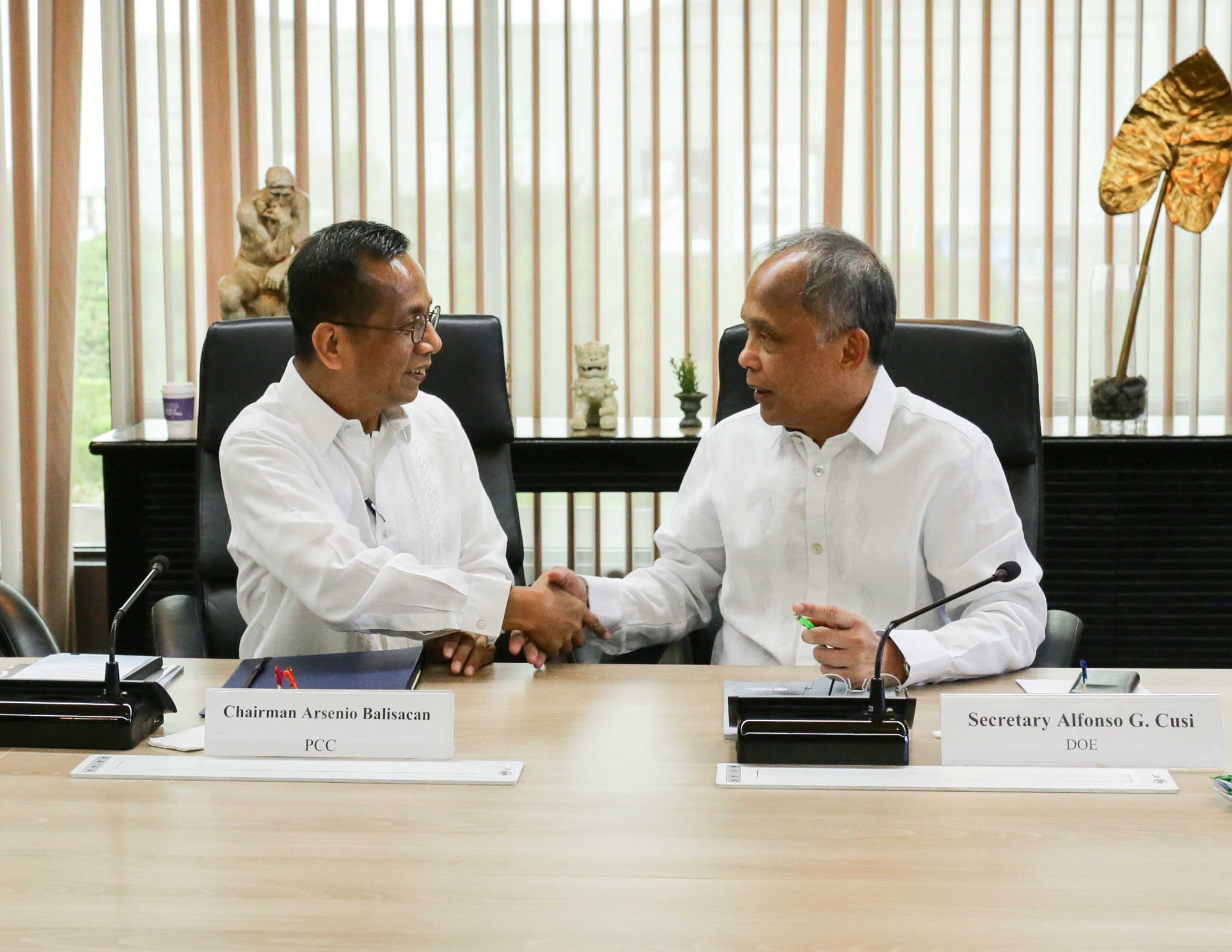 FORGING AN ALLIANCE FOR CONSUMER PROTECTION: Department of Energy Secretary Alfonso G. Cusi (right) and Philippine Competition Commission Chairman Arsenio M. Balisacan (left) sign a Memorandum of Agreement that would help ensure fair market competition in the energy industry and protect consumer interests today (11 June) at the Department's headquarters in Taguig City.