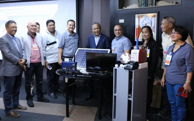 epartment of Energy Secretary Alfonso G. Cusi (center) signed the P131M worth memorandum of agreement that will energize far-flung areas with a prepaid solar home system at the DOE headquarters in Taguig City on Wednesday (Sept. 20, 2017). 