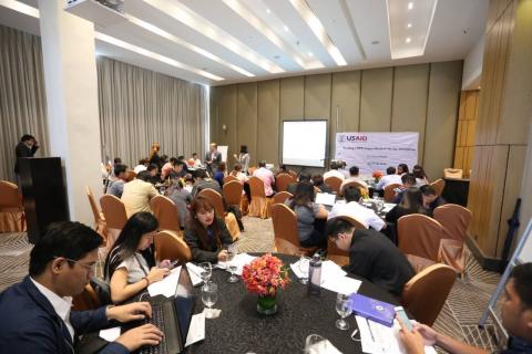 HANDS ON EXERCISE: Workshop participants fill up survey forms on the elements of compensation mechanisms. This activity is part of the two-day (9-10 July) USAID event, “Scoping a DPV Impact Analysis for the Philippines” held at the F1 Hotel Manila, BGC, Taguig City.