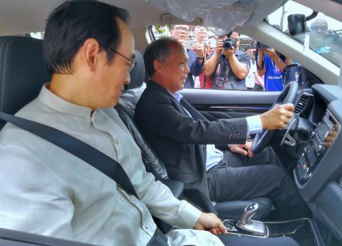 E-DISKARTE MO VEHICLES: Energy Sec. Alfonso G. Cusi, together with the Japanese Ambassador to the Philippines Koji Haneda, test-drives one of the four plug-in hybrid electric vehicles donated by the Japanese government.  The opening of DOE’s National Energy Consciousness Month (NECM) this Monday (4 December) kicked off with the unveiling of the four electric vehicles, four hybrid plug-in electric vehicles and a charging station inside the DOE Compound at its Motorpool.  The observance of NECM held in the mo